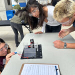 Youth Climate Fellows work with hydrogen fuel cells kits to understand how hydrogen can be harnessed as a renewable energy source using solar power.