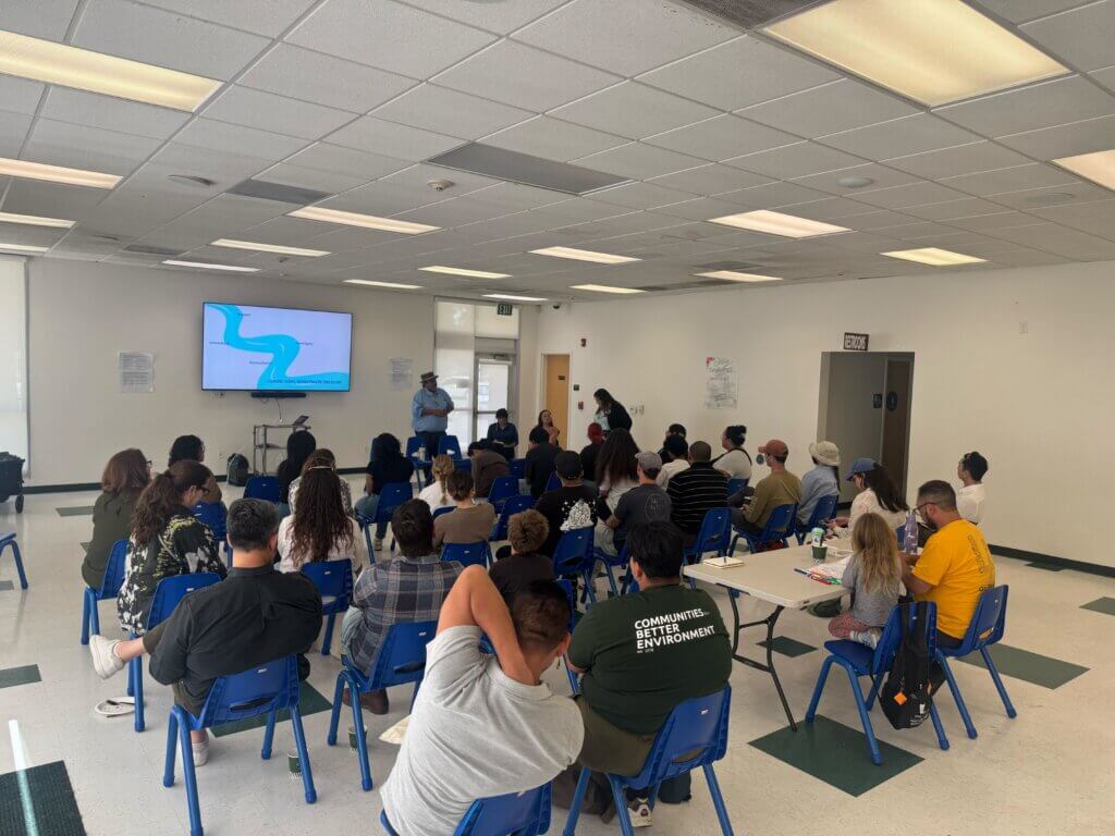 Climate resilience leadership program participants listen to a presentation at Huntington Park’s Community Center. 