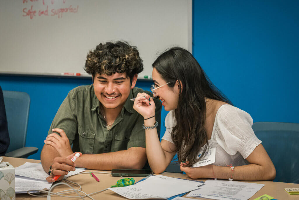 Participants in conversation during a session of our summer youth leadership program.