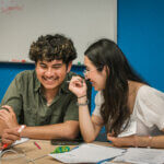 Participants in conversation during a session of our summer youth leadership program.