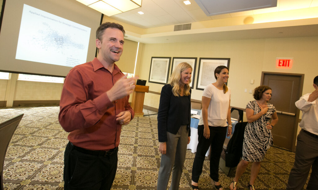 Delivering an improv workshop.