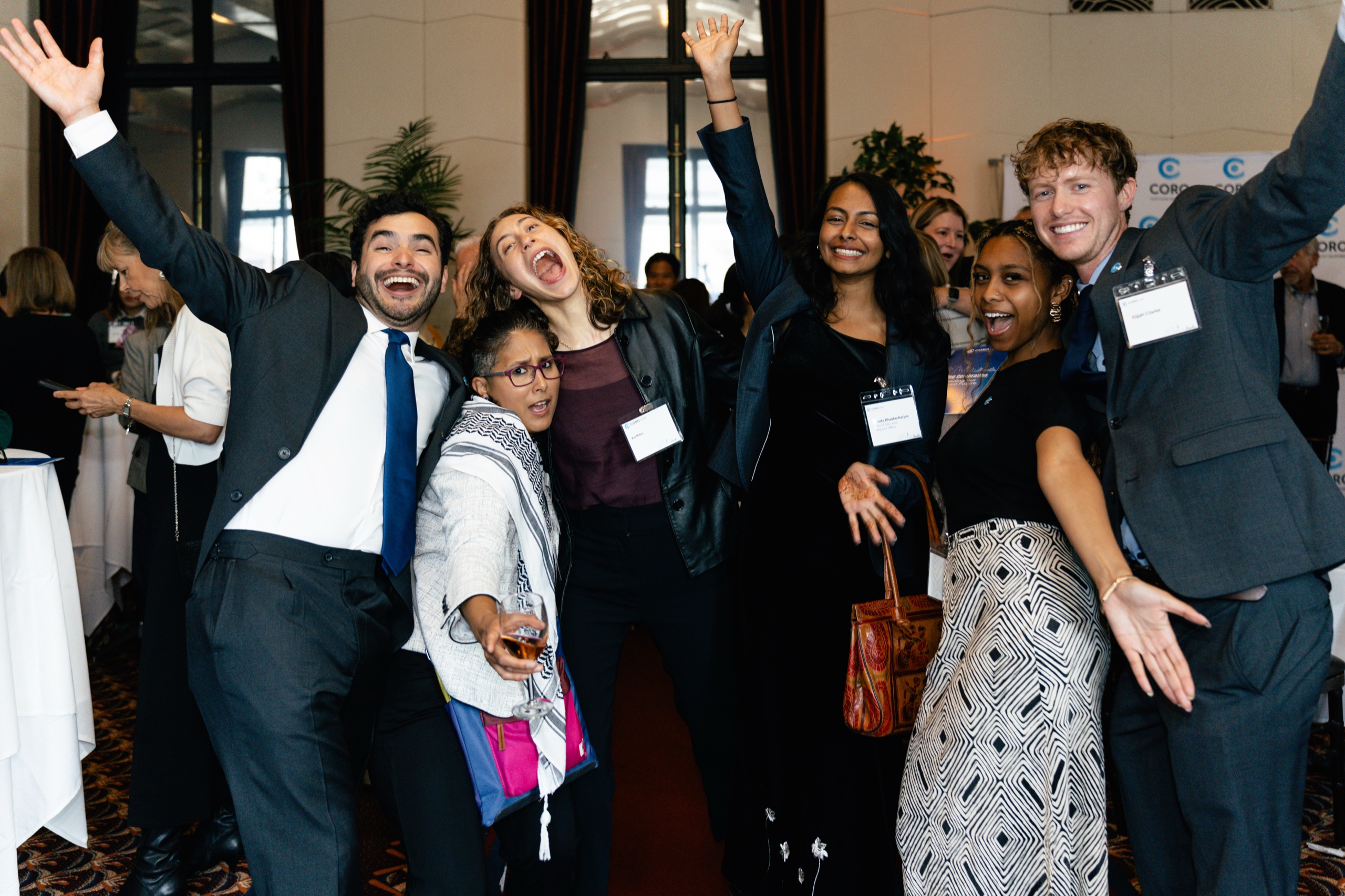 Coro community members celebrating together at an event