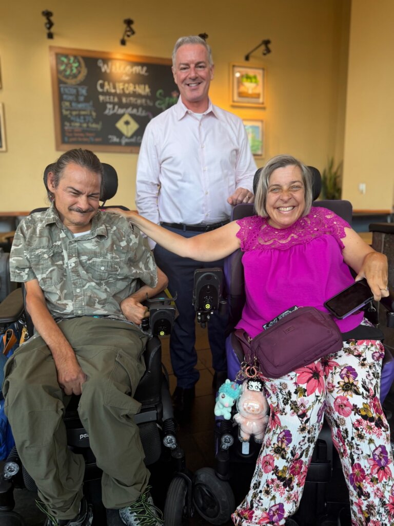 Aaron with Julie Gaona, current SCDD Chair, and her husband Rigo Gaona.